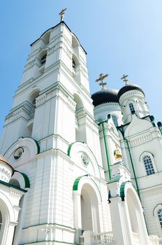 big tall white orthodox temple with cross on top. Grecian style. Cathedral church