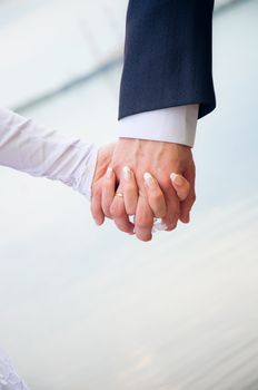 hand in hands. demonstration of love. wedding couple.