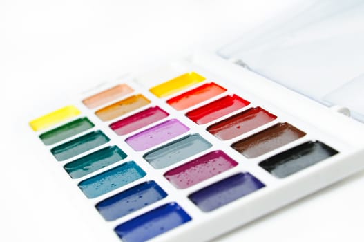 watercolour paints on a white background