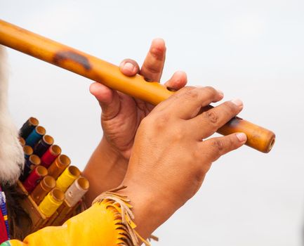 Peruvian Man In Native Costume Playing flute