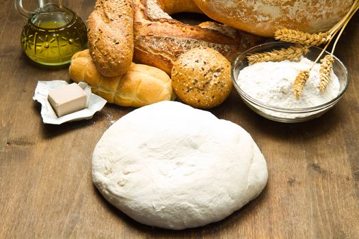 ingredients for homemade bread on wooden background