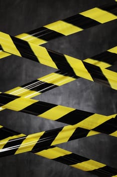 Black and yellow plastic barrier tape blocking the way. 