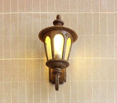 Vintage street lamp on brick wall 