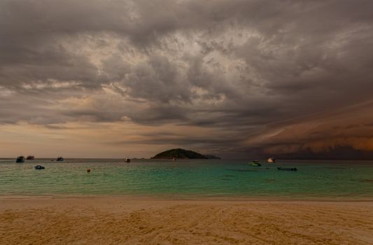 Sandy beach at sunset before a thunder-storm, Thailand