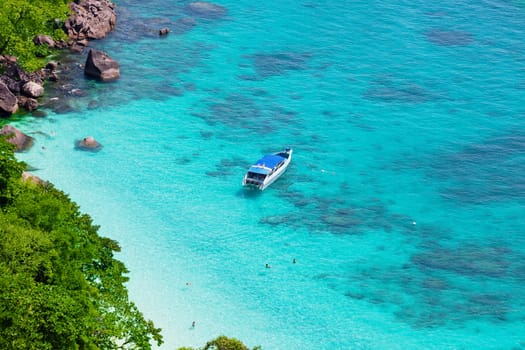 People swim in the sea near the beautiful yacht, Thailand