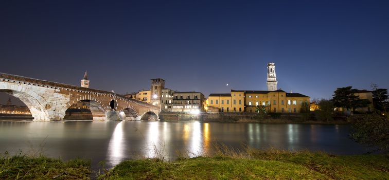 Ponte Pietra the oldest monument in Verona - Italy, and the river Adige