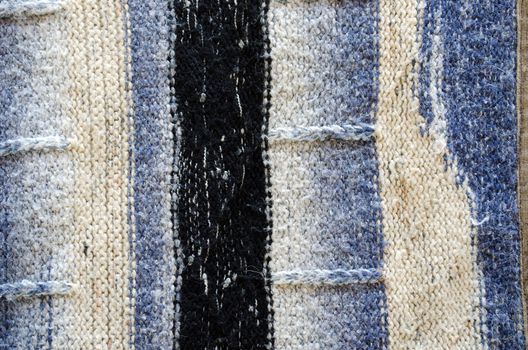 natural knit wool background of dirty handmade sweater pattern texture closeup.