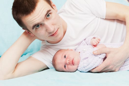 happy young father with the newborn baby