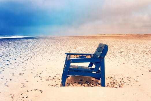 A stranded chair on the beach in denmark