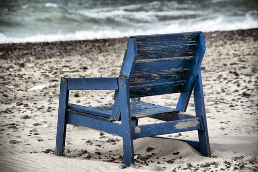 A stranded chair on the beach in denmark