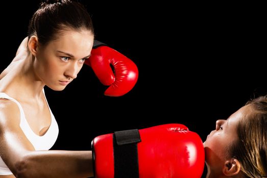 Aggressive boxing woman, hits an opponent in the head