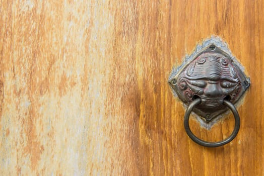 Old vintage chinese temple wooden door with metal chinese door handle