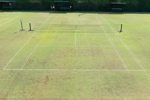 Traditional english out door grass tennis court, taken on a sunny day