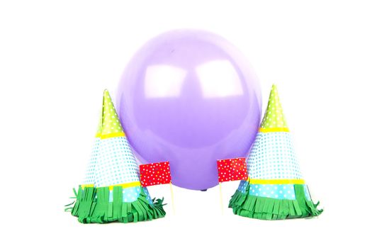 Party hats with balloon isolated in white