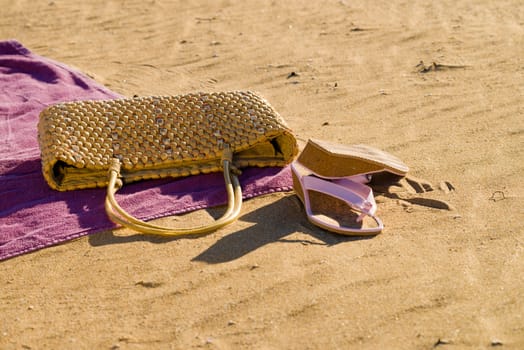 Beach items resting on  sunny beach sand