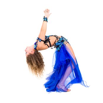 Young beautiful belly dancer in a blue costume full length studio portrait isolated on white
