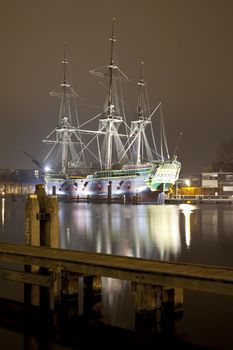 historic ship Amsterdam at night in harbor of Amsterdam, The Netherlands
