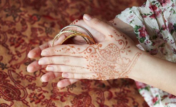 Picture mehandi on the hand of girl