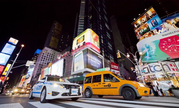 NEW YORK CITY - SEPT 25: Times Square, featured with Broadway Theaters, Taxi Cabs and animated LED signs, is a symbol of New York City and the United States, September 25, 2012 in Manhattan, New York City