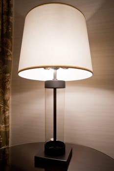 Lit lamp in a room