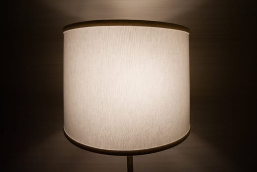 Lit lamp in a room