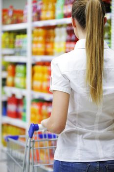 Woman with shopping cart, close up