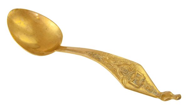 Old and Classic Gold Spoon isolated on White Background