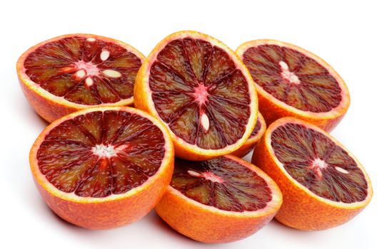 Six Halves of Blood Oranges closeup on white background