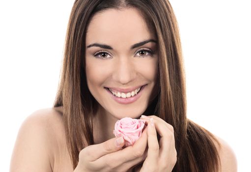 Beautiful woman with pink rose on white background
