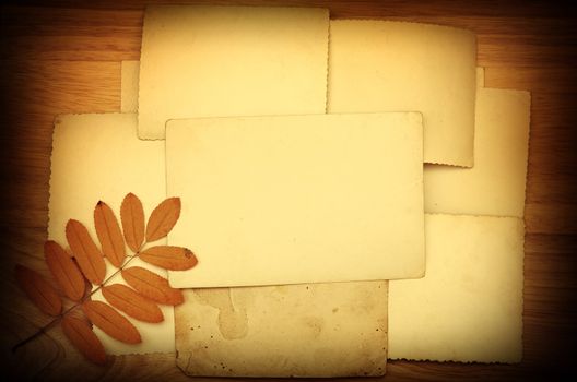 Vintage Papers on old wooden wall background
