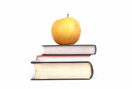 Apple On The Books Isolated on the White Background