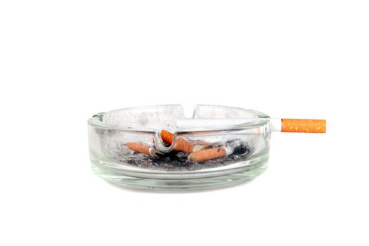 Dirty Ashtray and Cigarette Closeup Isolated On the White Background