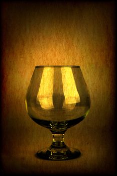 Vintage and Toned Photo of the Glass on Dark Brown Background