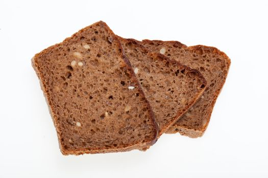 Slices of dark bread isolated over white 
