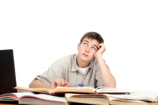 Handsome Student is Dreaming on the School Desk. Isolated on the White Background