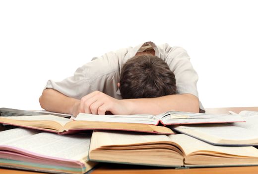 Tired Teenager lying and sleeping on the School Desk