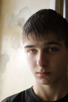 Sad Teenager Portrait against old wall background