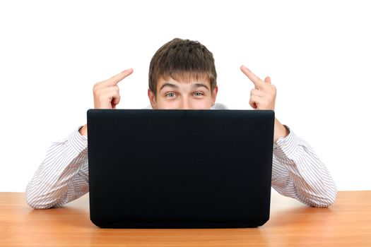 Young Man Shows Middle Fingers Gesture behind Laptop. Isolated on the White Background