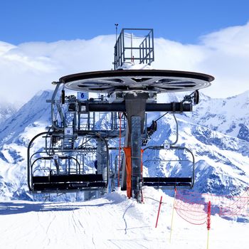 Ski chair-lift arrival in alpine mountain, France