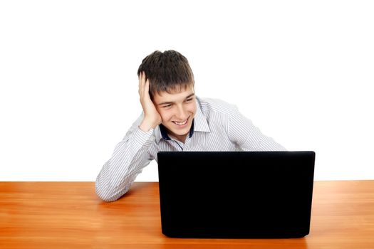 Happy Teenager using Laptop and Smiling. Isolated on the white background