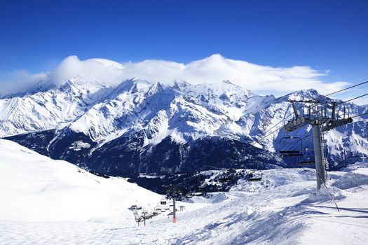 Ski chair-lift in alpine mountain, France