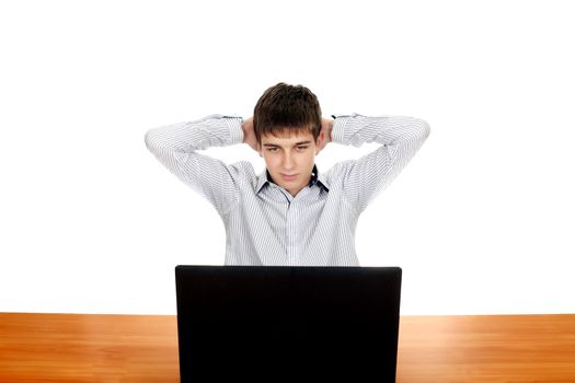 Young Man with Laptop at the Desk. Isolated on the white background