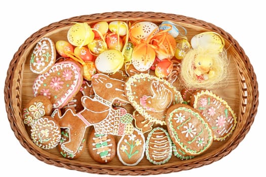 collection of easter gingerbreads and painted eggs isolated on white