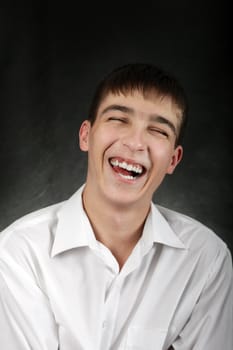 Happy Young Man Portrait on the Black Background