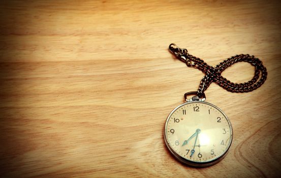 Vintage Watch on the Wooden Background