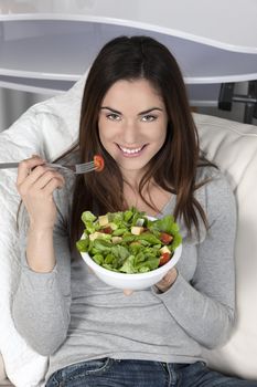 Young beautiful girl eating healthy food 