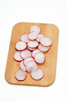 Garden radish on wooden board 