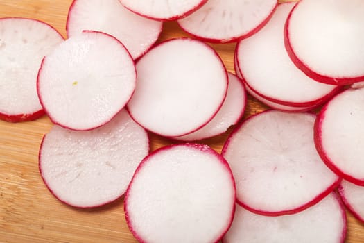 Garden radish on wooden board 