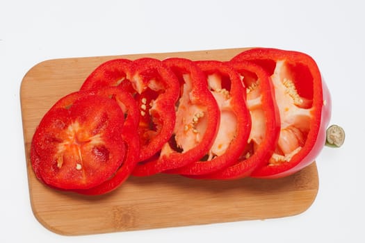 Sliced red pepper isolated on white background