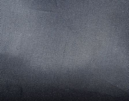 Black polyester texture background. Close up